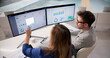 © Andrey Popov - Corporate Team Working Together With Enterprise ERP Software For Financial