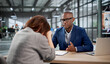 © Andrey Popov - Young Woman Looks Unhappy During A Tough Office Meeting With HR Staff
