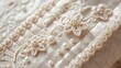 © irenka - extreme close up of a historical regency period dress bodice with intricate floral embroidery and pearl embellishments