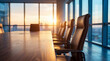 © Jonathan - Modern office conference room with a long wooden table and chairs, illuminated by warm light and city view.