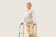 © Pixel-Shot - Mature woman with walker on light background
