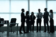 © Pixel-Shot - Silhouettes of business people talking in office
