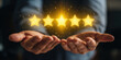 © javu - Business glowing five star rating held open hands symbolizing customer satisfaction and quality