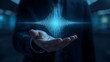 © Tahlil007 - A human hand gently cradles a striking, glowing blue sound wave visualization, representing audio technology, communication, or data signals.