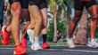 © pixfly - Group running session in park environment showing active people training together for health endurance and outdoor fitness lifestyle