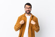© luismolinero - Caucasian handsome man with beard wearing a corduroy jacket over isolated white background with surprise facial expression