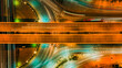 © AU USAnakul - Top view aerial shot of symmetrical highway interchange at night, glowing orange traffic streams crossing smooth curved roads, captured with high angle and neon lighting, representing modern transport
