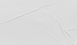 © chathuporn - crumpled paper texture overlay effect PNG, white paper wrinkled poster template ,blank glued creased paper sheet mockup.white poster mockup on wall.