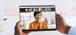 © Prostock-studio - A doctor consults with a patient through a web conference on a digital tablet. The setting is a clinic with a focus on telehealth and remote medical support.