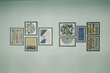 © jinhongljh - Modern art prints arranged on a light-colored wall. Geometric and abstract patterns fill each framed piece. Varied textures and colors create a balanced visual composition. Frames are minimalist