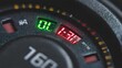© ASRI - Close-up view of a car dashboard with digital displays showing green '0.L.' and red '1:30' indicators, alongside a partial analog gauge.
