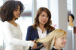 © auremar - hairdresser apprentice doing a hairdo to client