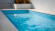 © photo for everything - Inviting blue water of a clean, tranquil swimming pool on a sunny day, showcasing pristine, calm aquatic surface for relaxation and resort vibes