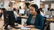© Justlight - Multilingual customer support specialist actively listening during a claim inquiry isolated in sharp focus against a softly blurred office environment.