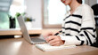 © Stella 16 - Young Woman Writing in a Notebook While Enjoying Her Beverage at Home, remote work and reminder. Freelancer, personal assistant and tea with notepad for to do list, diary management and planning