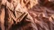 © Artastic - Crumpled terracotta linen fabric background with warm natural light and organic folds for sustainable lifestyle branding