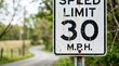 © jasminumsambac - A thirty miles per hour speed limit sign outdoors