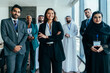 © oneinchpunch - Diverse corporate business team collaborating in a dubai office