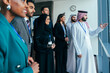 © oneinchpunch - Multiethnic corporate business team meeting in dubai office
