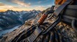 © Helen - A detailed view of climbing equipment, including a carabiner with the word 'COMMITMENT' engraved, connected to orange webbing and a harness, set against a rocky mountain backdrop