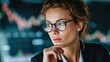 © iwan - Woman analyzing financial data on a digital screen thoughtful expression