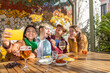 © ADDICTIVE STOCK - Friends enjoying tapas and capturing moments
