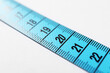 © New Africa - One measuring tape on white background, closeup