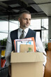© be free - Upset office worker fired. Fired and unemployment with business man. Job loss. Fired jobless employee. Unemployment crisis of man dismissed, work stuff. Business man packing stuff. Last day at work