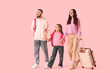 © Pixel-Shot - Family of travelers with bags walking on pink background