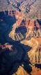 © Nancy - Majestic Aerial View Of A Vast Canyon With A Winding River Below