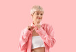 © Pixel-Shot - Stylish young woman with short hair on pink background
