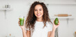 © Pixel-Shot - Young African-American woman drinking healthy smoothie in kitchen