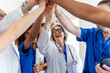 © unai - Diverse medical team collaborating with high five gesture