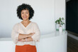 © Westend61 - Confident businesswoman smiling in modern office portrait