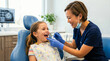 © Xenia - Female dentist examining young girl's teeth in dental chair. Smiling child during dental checkup in clinic. Pediatric dentistry concept