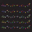 © Shsmim - Colorful festive light garlands in various vibrant tones hanging against a dark background