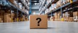 © Mariia - Cardboard box with question mark in warehouse aisle. Lost or missing package concept, logistics confusion, delivery problem and supply chain uncertainty