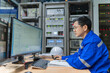 © reewungjunerr - Engineer working at control room,Manager control system,Technician man monitoring program from a lot of monitor