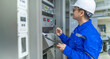 © reewungjunerr - Electrical engineer woman checking voltage at the Power Distribution Cabinet in the control room,preventive maintenance Yearly,Thailand Electrician working at company
