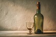 © Margarita Vais  - The scene shows a Georgian wine bottle standing next to a small glass. They rest on a clean surface, with soft light highlighting their shapes. The setting has a warm mood and a simple look