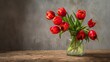 © Suleyman - Bright red tulips in a vase sit on a rough wooden table. This scene is great for pictures of flowers, decorating homes, spring displays, and warm room designs.