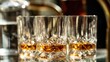 © 4kclips - Luxury lifestyle and celebration concepts A close-up of crystal whiskey glasses filled with bourbon scotch or liquor upscale bar restaurant or home entertaining themes The golden amber liquid.