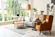 © Pixel-Shot - Interior of stylish living room with sofa, tables and paintings