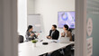 © fizkes - Diverse business executives discussing financial strategy, collaborate on project, listen team leader presenting idea, solution or point during formal meeting in office boardroom. Strategic planning
