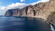 © Patryk - Majestic Los Gigantes cliffs in Tenerife overlooking the calm ocean on a sunny day.
