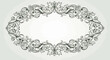 © Sendal - Ornate black and white floral scrollwork creates an elegant oval frame
