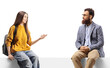 © Ljupco Smokovski - Female teenager sitting on a panel and talking to a bearded man