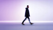 © Curioso.Photography - Blurred man walking in motion in modern gradient studio, symbolizing movement, speed and contemporary lifestyle.