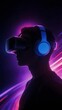 © jiale - Silhouette of a person wearing virtual reality headset and headphones, illuminated by vibrant purple and pink light effects