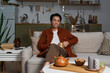 © Bliss - Joyful moments in a cozy modern apartment with a friendly asian man enjoying his time
